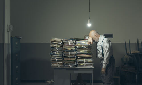 desperate-business-executive-with-lots-of-paperwor-2021-08-30-02-07-49-utc