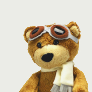 Bilde av en teddybjørn med flygerbriller og skjerf