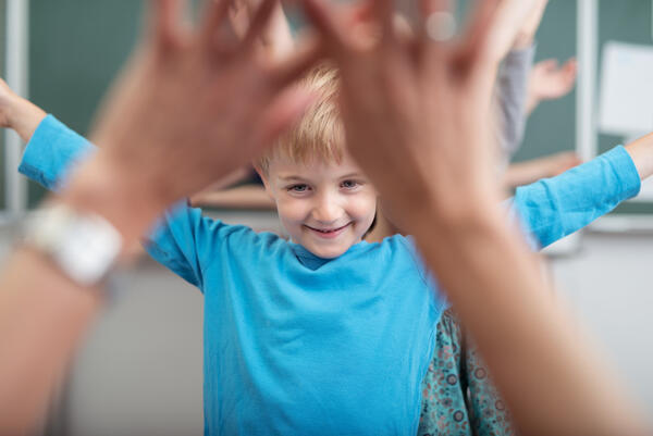 mp12819863-young-children-rejoicing-as-they-play-at-school