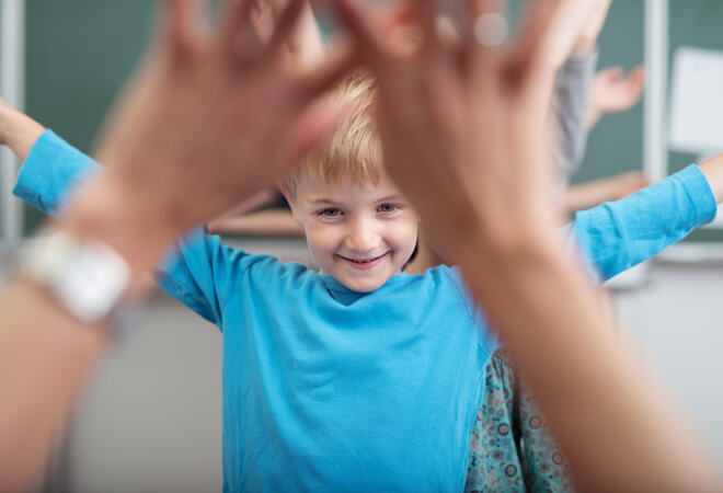 mp12819863-young-children-rejoicing-as-they-play-at-school