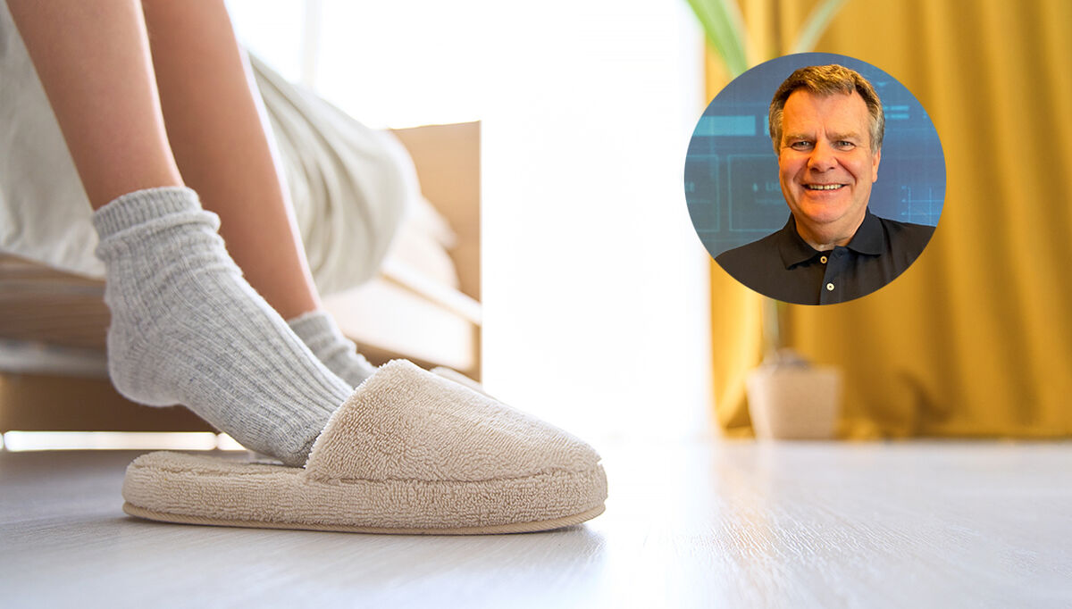 Cropped photo of unrecognizable child in socks with pulls socks,